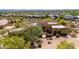 Aerial view of a Southwestern home with lush landscaping and desert vegetation at 22050 N 90Th St, Scottsdale, AZ 85255