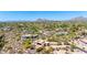Stunning aerial perspective of a southwestern-style estate with a pool, set against a backdrop of distant mountains at 22050 N 90Th St, Scottsdale, AZ 85255