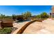 Backyard featuring a flagstone patio, a built-in spa, and desert landscaping at 22050 N 90Th St, Scottsdale, AZ 85255