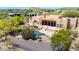 Aerial view highlights a custom pool, putting green, and outdoor entertaining space in a desert-landscaped backyard at 22050 N 90Th St, Scottsdale, AZ 85255
