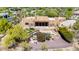 Aerial view of private backyard pool, putting green, and patio, blending leisure with elegant southwestern design at 22050 N 90Th St, Scottsdale, AZ 85255