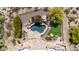 Aerial view of backyard oasis with a private pool, putting green, and entertainment area, perfect for relaxation at 22050 N 90Th St, Scottsdale, AZ 85255