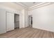 Light bedroom with wood floors and a closet with sliding doors at 22050 N 90Th St, Scottsdale, AZ 85255