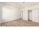 Bedroom with neutral walls and flooring with a closet with sliding doors at 22050 N 90Th St, Scottsdale, AZ 85255