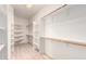 Well-organized walk-in closet featuring multiple shelves and rods for ample storage space at 22050 N 90Th St, Scottsdale, AZ 85255