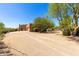 Charming home featuring desert landscaping, a circular drive, and an attached two-car garage at 22050 N 90Th St, Scottsdale, AZ 85255