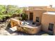 Charming courtyard with a gated entrance, a tranquil fountain, and lush landscaping, creating a serene outdoor oasis at 22050 N 90Th St, Scottsdale, AZ 85255