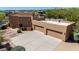 Southwest home boasts three-car garage, RV parking, and ample space for outdoor activities, blending style with functionality at 22050 N 90Th St, Scottsdale, AZ 85255