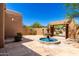Charming courtyard featuring a serene water fountain and lush desert landscaping at 22050 N 90Th St, Scottsdale, AZ 85255