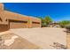 Attached garage with ample parking space and neutral-colored doors enhancing the home's curb appeal at 22050 N 90Th St, Scottsdale, AZ 85255
