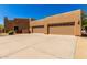Attached garage with ample parking space and neutral-colored doors enhancing the home's curb appeal at 22050 N 90Th St, Scottsdale, AZ 85255