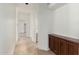 Long hallway with neutral paint and natural stone flooring at 22050 N 90Th St, Scottsdale, AZ 85255
