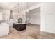 Open-concept kitchen with white cabinets, stainless steel appliances, and an island at 22050 N 90Th St, Scottsdale, AZ 85255