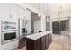 Modern kitchen with stainless steel appliances, a center island, and an open layout at 22050 N 90Th St, Scottsdale, AZ 85255