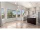 Bright open kitchen and dining area features stainless appliances, island seating, and views at 22050 N 90Th St, Scottsdale, AZ 85255