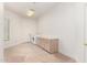 Spacious laundry room with side by side washer and dryer, storage cabinets, and a large window at 22050 N 90Th St, Scottsdale, AZ 85255