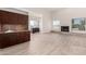 Comfortable living room area with wet bar and fireplace creates an inviting space for relaxing or entertaining at 22050 N 90Th St, Scottsdale, AZ 85255