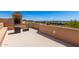 Rooftop deck with an outdoor fireplace and desert views at 22050 N 90Th St, Scottsdale, AZ 85255