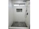 A modern bathroom featuring gray tiled floor, white shower and vanity at 22261 W Tonto St, Buckeye, AZ 85326
