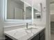 Bathroom featuring vanity with modern sink, illuminated mirror and clean contemporary design at 22261 W Tonto St, Buckeye, AZ 85326
