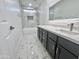 Modern bathroom featuring vanity, tub and shower combo with beautiful tile at 22261 W Tonto St, Buckeye, AZ 85326