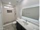 A modern bathroom is equipped with sleek fixtures and updated tile at 22261 W Tonto St, Buckeye, AZ 85326