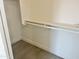 Walk-in closet offers a shelf and rod for hanging clothes and storing belongings at 22261 W Tonto St, Buckeye, AZ 85326