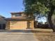 Attractive two-story home with a two-car garage, tile roof, and well-maintained yard at 22261 W Tonto St, Buckeye, AZ 85326