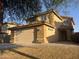 Inviting two-story home with a tile roof, manicured landscaping, and a spacious garage at 22261 W Tonto St, Buckeye, AZ 85326