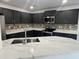 Well-equipped kitchen showcasing granite countertops, tile backsplash, and stainless steel appliances at 22261 W Tonto St, Buckeye, AZ 85326