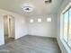 Bright, airy living room featuring tile floors, recessed lighting, and large window at 22261 W Tonto St, Buckeye, AZ 85326