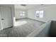 Open area featuring wood-style floors, plenty of light, and a view of the neighborhood at 22261 W Tonto St, Buckeye, AZ 85326