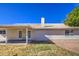 Relaxing backyard with a covered patio area and views of the surrounding landscape at 2317 E Lynwood St, Mesa, AZ 85213