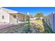 Expansive backyard featuring a covered patio, lush vegetation, and ample space for outdoor activities at 2317 E Lynwood St, Mesa, AZ 85213