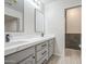 Bathroom featuring a modern vanity with dual sinks and a stylish, updated shower at 2317 E Lynwood St, Mesa, AZ 85213