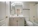 Bathroom vanity featuring grey cabinets, quartz countertop, and modern fixtures at 2317 E Lynwood St, Mesa, AZ 85213