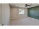 Spacious bedroom featuring a designer accent wall, neutral paint and carpet flooring at 2317 E Lynwood St, Mesa, AZ 85213