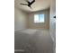 Light and airy bedroom featuring carpet, ceiling fan, recessed lights, and a large window at 2317 E Lynwood St, Mesa, AZ 85213