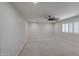 Bedroom featuring neutral carpet, ceiling fan, recessed lights, and a window with shutters at 2317 E Lynwood St, Mesa, AZ 85213