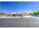 Street view of a single-story home with a tile roof, low-maintenance landscaping, and an attached garage at 2317 E Lynwood St, Mesa, AZ 85213