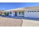 Charming single-story home featuring desert landscaping, a tile roof, and a cozy front porch at 2317 E Lynwood St, Mesa, AZ 85213