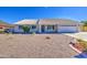 Single-story home with a tile roof and desert landscaping on a sunny day at 2317 E Lynwood St, Mesa, AZ 85213