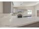 Gorgeous kitchen featuring white countertops, stainless steel appliances and grey cabinetry at 2317 E Lynwood St, Mesa, AZ 85213