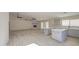 Spacious living area showcasing the brick fireplace and updated kitchen with an island at 2317 E Lynwood St, Mesa, AZ 85213