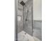 Walk-in shower showcases gray tiling and a stone floor, creating a clean and modern look at 2317 E Lynwood St, Mesa, AZ 85213