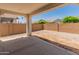 Covered patio and large backyard with a brick wall, offering privacy at 24580 N 144Th Ave, Surprise, AZ 85387