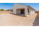 Backyard view of a patio and a brick wall, ensuring privacy at 24580 N 144Th Ave, Surprise, AZ 85387