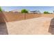 Large, sunny backyard with a brick wall for extra privacy at 24580 N 144Th Ave, Surprise, AZ 85387