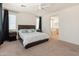 Comfortable bedroom featuring an ensuite bathroom and a ceiling fan at 24580 N 144Th Ave, Surprise, AZ 85387