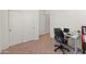 Comfortable bedroom features ample closet space and a functional desk area perfect for work or study at 24580 N 144Th Ave, Surprise, AZ 85387